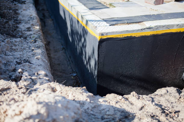 Professional Waterproofing technician working in Knightsville, IN
